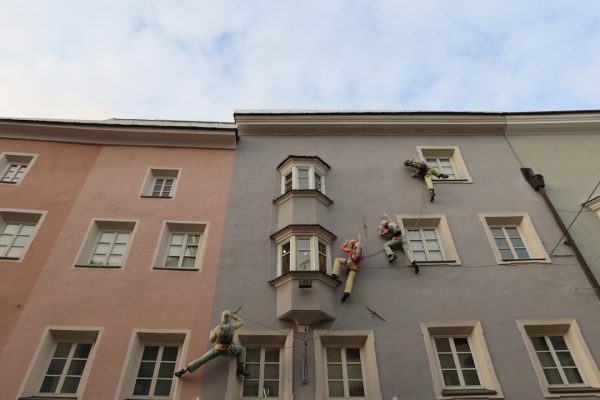 a tall building with a clock on the side of it